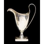 A silver Peter & Anne Bateman helmet shaped cream jug