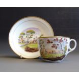 A Newhall bute shaped tea cup and saucer, printed with coloured rural scenes, Patt No.