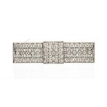 An Art Deco diamond and platinum rectangular brooch,