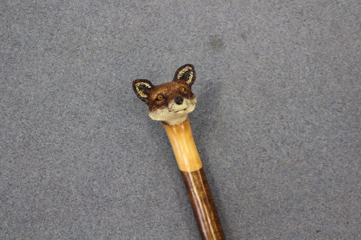 Ian Taylor, a hand crafted walking stick, the handle carved in the form of a foxes' head,