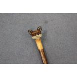 Ian Taylor, a hand crafted walking stick, the handle carved in the form of a foxes' head,