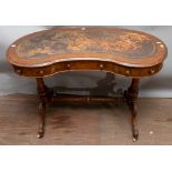 A mid Victorian walnut kidney shaped writing desk, having an inset leather top,
