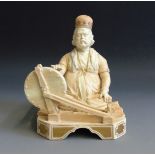 A rare Royal Worcester figure of an Indian Craftsman, picked out in blush ivory and gilt,