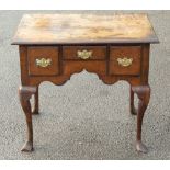 A George II joined oak lowboy, circa 1740, fitted with three drawers,