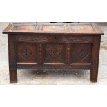 A late 17th Century oak joined chest, carved three panelled front, panelled top, panel sides,