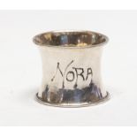 An Arts & Crafts silver hammered napkin ring inscribed Nora, by Ramsden & Carr, London 1901, 1.