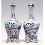 A pair of Chinese under glazed red and blue bottle vases, 19th Century,
