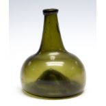 An 18th Century olive green onion wine bottle, kick-in base,