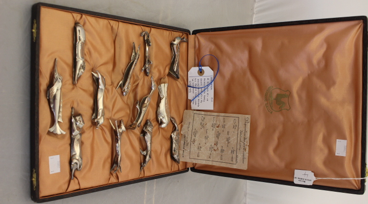 A cased Art Deco set of plated Callia knife rests in the form of various animals, each piece signed,