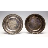 A pair of 19th Century French silver dinner plates, with guilloche style borders,