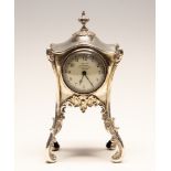 An Art Nouveau silver mounted dressing table clock,