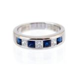 A sapphire and diamond half eternity 18ct white gold ring,