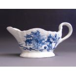An English porcelain blue and white sauce boat,