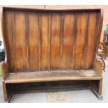 A large 19th Century pine church pew,