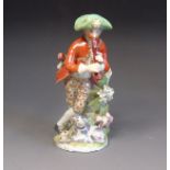 A Bow figure of a boy piper, leaning on a tree stump with a dog at his feet, circa 1760-65,