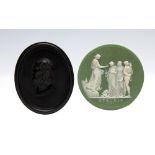 A Wedgwood green jasper dip circular medallion, inscribed Etruria and dated 1789, depicting Hope,