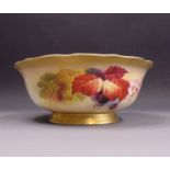 A Royal Worcester bowl painted with autumnal leaves and berries, signed Kitty Blake,