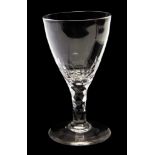 A late 18th Century Port glass, the bowl on a facet cut stem,