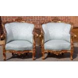 A pair of French giltwood gesso framed bergere chairs, moulded backs, upholstered backs and seats,