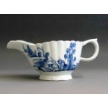 A Vauxhall blue and white sauce boat with a fluted body,