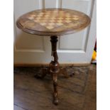 A mid Victorian walnut and marquetry inlaid chequer topped pedestal table,