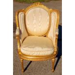 A 19th Century French giltwood armchair, with an oval padded back, rounded seat,