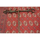 A pair of Tudor Gothic building iron tie-anchors, circa 1552, with witch protection markings,