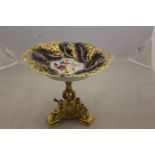 A 19th Century ormolu comport plinth,