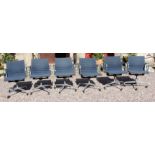 A set of six 1960s/1970s 'Eames' aluminium group, blue sling swivel armchairs.