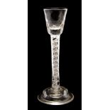 A mid 18th Century cordial glass, dimple glass bowl, double air twist stem, dome shaped foot,