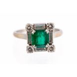 An emerald and diamond square cluster white gold ring by Mauboussin,