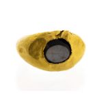 A Roman yellow gold signet ring, the oval head set with chalcedony,