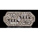 An Art Deco diamond and platinum brooch, the geometric design comprising round brilliant,