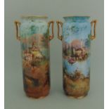 A pair of Royal Doulton cylindrical twin handled vases,