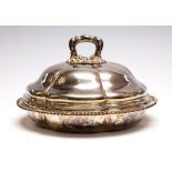 A William IV silver shaped circular entrée dish and cover, the plain body with gadroon rim,