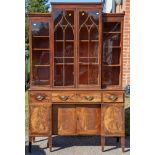 A George III mahogany two-tier bookcase, circa 1800, the upper section of breakfront form,