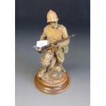 John Broad for Doulton Lambeth, a salt-glazed stoneware figure of Boer War soldier with rifle,