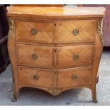 A French 19th Century kingwood veneered Bombe commode, fitted with three drawers,