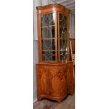 A Georgian style mahogany bow fronted corner cabinet, 200cm high, 88cm wide,