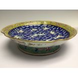 A famille rose footed dish, mid 19th Century, with cranes on a blue ground,