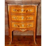 An early 20th Century French serpentine fronted bombe commode, of Louis XVI design,