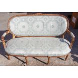 A French giltwood three seater settee, carved frame, gesso edged,