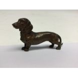 An early 20th Century miniature bronze figure of a daschund dog,