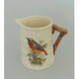 A Royal Worcester small barrel shaped milk jug, painted with a Redstart, signed W.