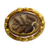 A Victorian yellow gold oval swivel brooch, comprising glazed compartments front and back,