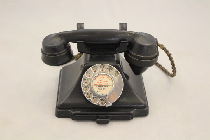 A 1950's black bakelite 200 series desk telephone, the handset dated 1957,