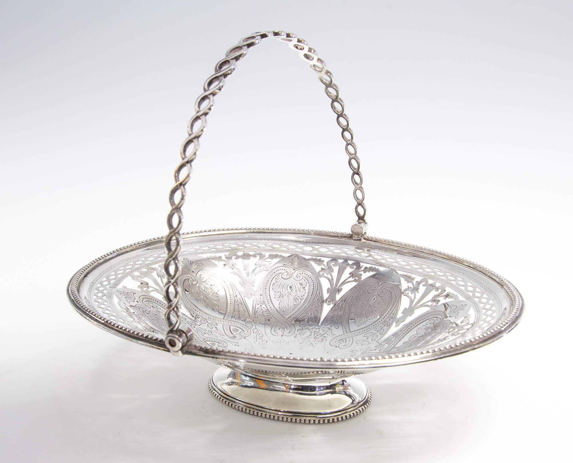 A Victorian silver fruit basket, bright cut reticulated foliate design,