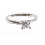 A diamond solitaire platinum ring, the princess cut diamond weighing approx 0.