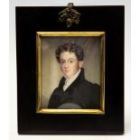 A mid 19th Century portrait miniature on ivory, circa 1850, a young gentleman,