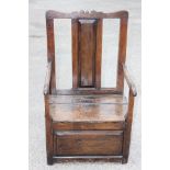 A late 17th Century or later oak and elm joined box armchair,